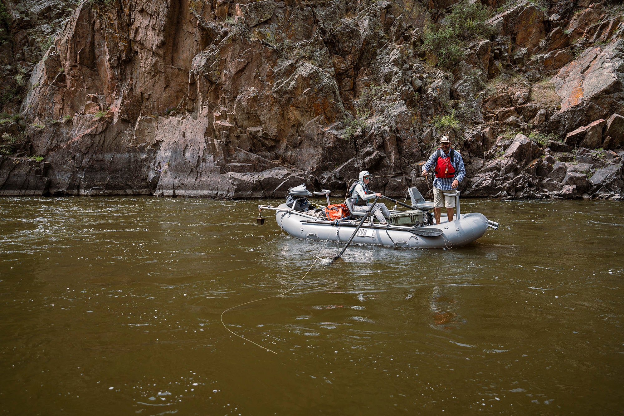 An angler fishing from a raft on the Colorado River with a guide from Vail Valley Anglers.